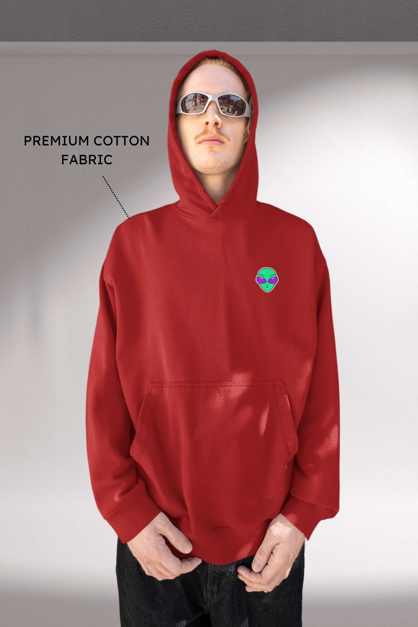 Alienhead Hoodie in red, front view worn by male model showcasing bold alien graphic and relaxed fit